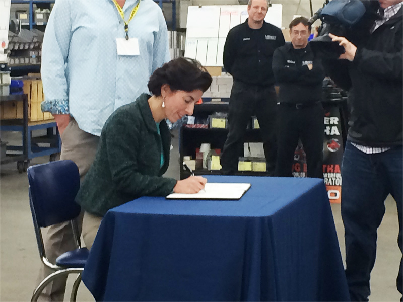 raimondo-comes-to-vibco-april-2015-lean-in-rhode-island--signing-1